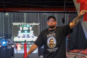 Craig Jones kisses Gabi Garcia before their CJI match