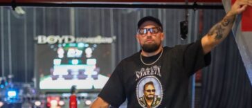 Craig Jones kisses Gabi Garcia before their CJI match