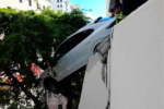 Driver Rescued After Porsche Plunges From Third Floor Garage