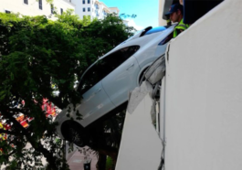 Driver Rescued After Porsche Plunges From Third Floor Garage
