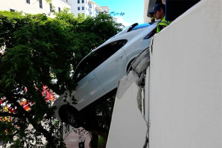 Driver Rescued After Porsche Plunges From Third Floor Garage