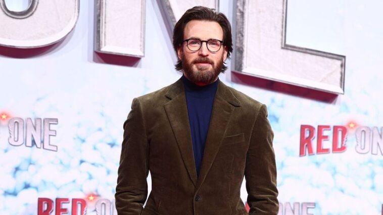 Chris Evans Unveils Scruffy Look for “Red One” Promo